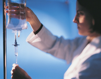 Nurse with IV bag.